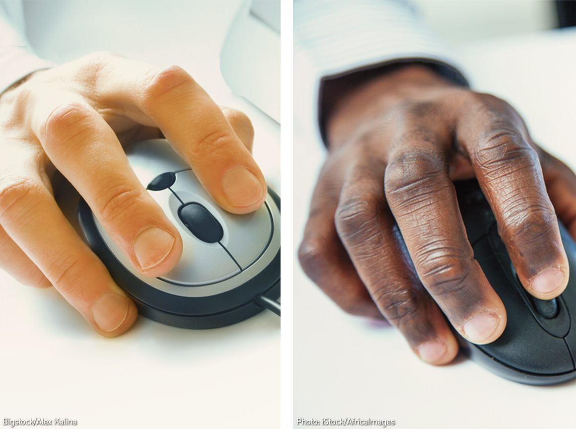 A white hand on a computer mouse side by side with a black hand on a computer mouse